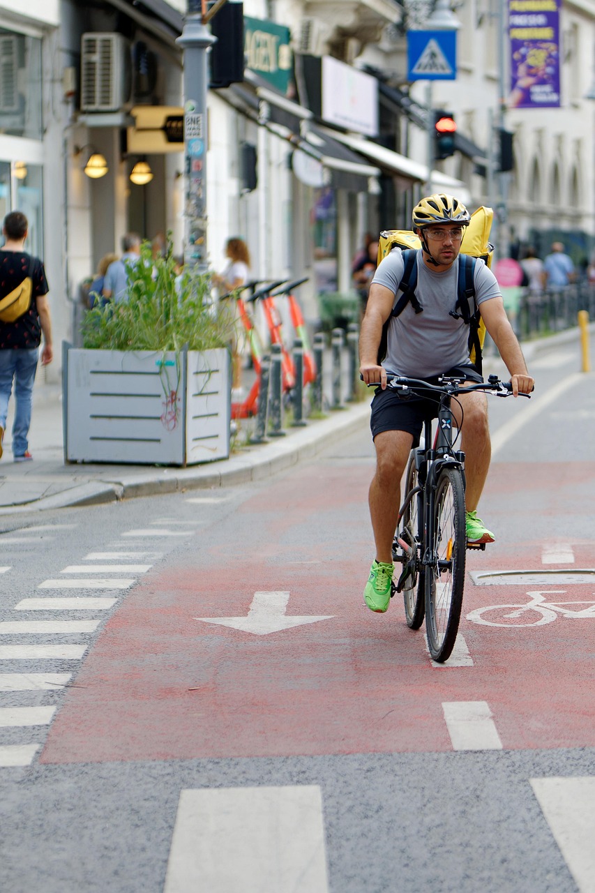 cyclist, man, courier, bike, backpack, road, bike lane, street, people, buildings, urban, cityscape, bike lane, bike lane, bike lane, bike lane, bike lane