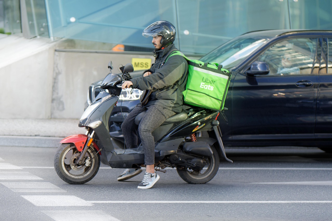 food delivery, courier, motorcycle, waiting, traffic, transport, delivery, street, road, city, urban, man, job, helmet, box, snapshot, street photography